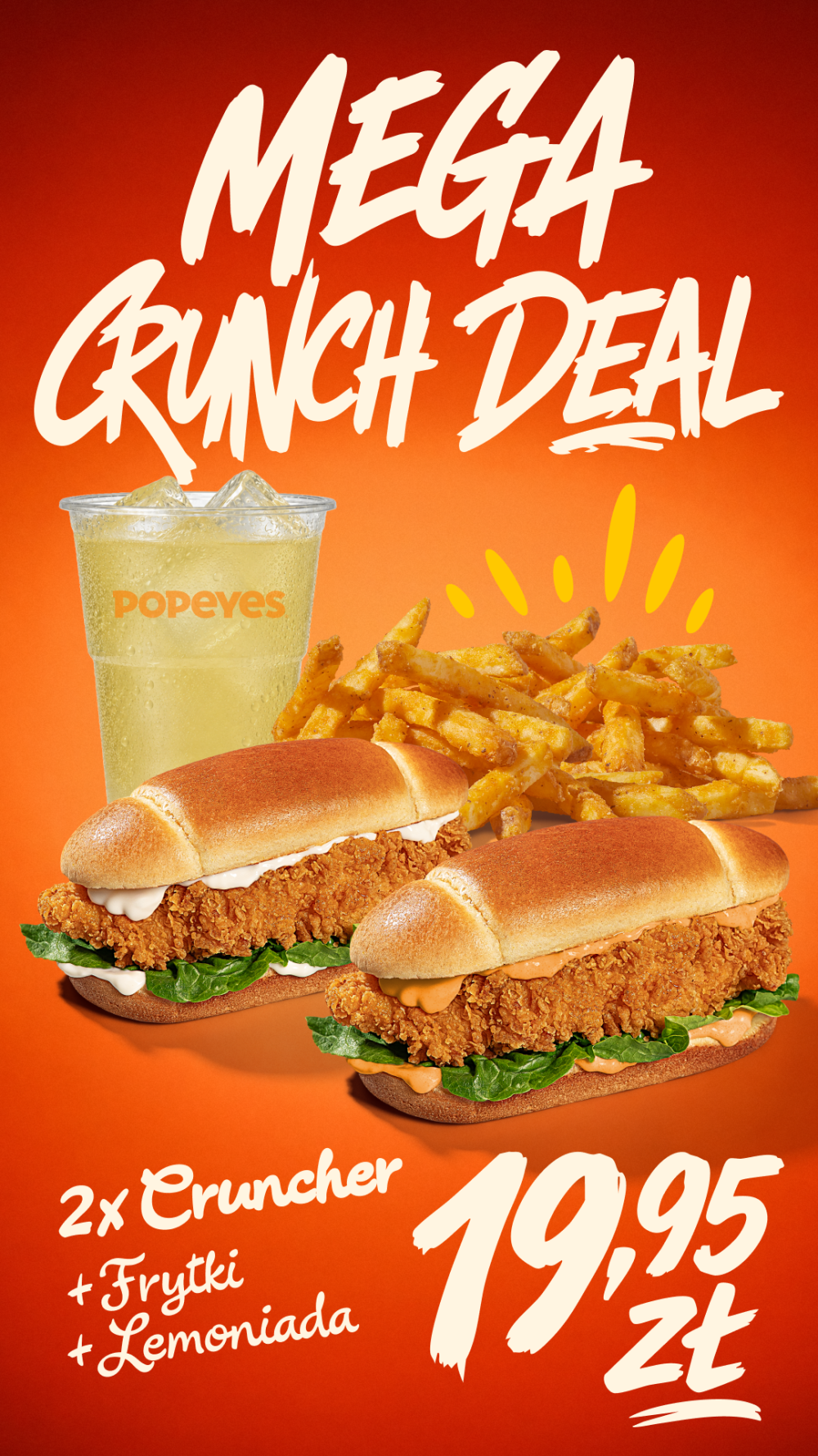 Zestaw Mega Crunch Deal z Popeyes na pomarańczowym tle, zawierający dwa sandwicze z kurczakiem, frytki i lemoniadę, z ceną 19,95 zł.